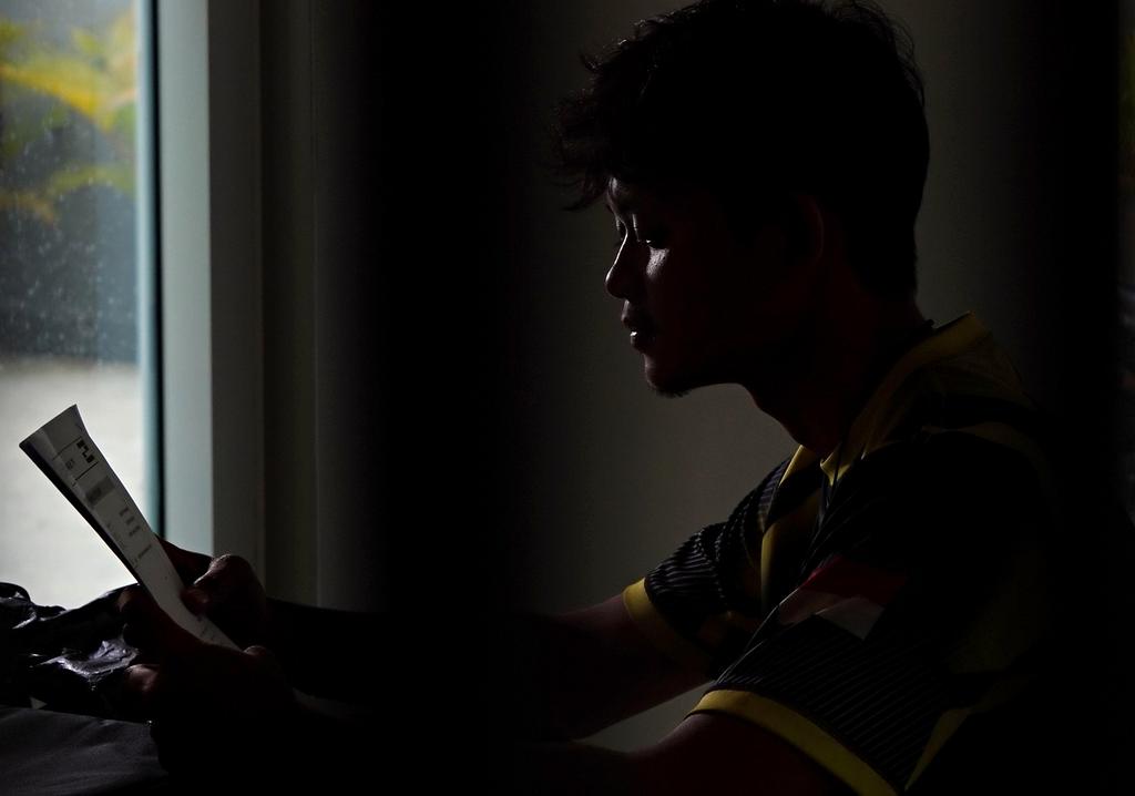 Person meditating at sunrise on a scenic hilltop