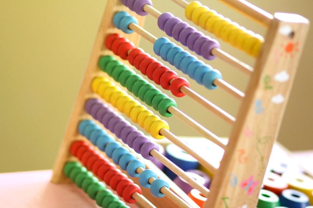 Open book and digital tablet with educational content on healthy habits